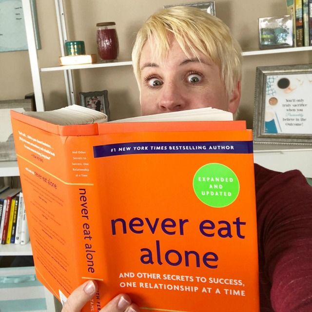 Jenny reading Never Eat Alone